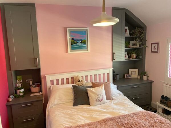 Bespoke fitted furniture designed around an awkward room shape