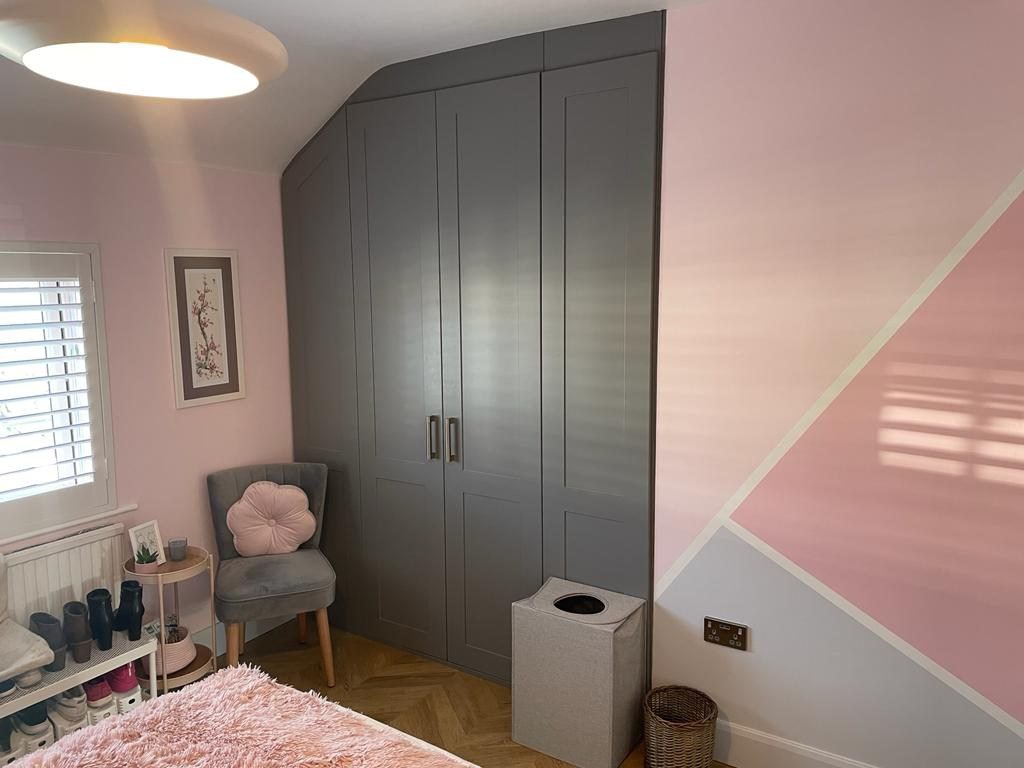 Bespoke storage built into a sloping loft ceiling