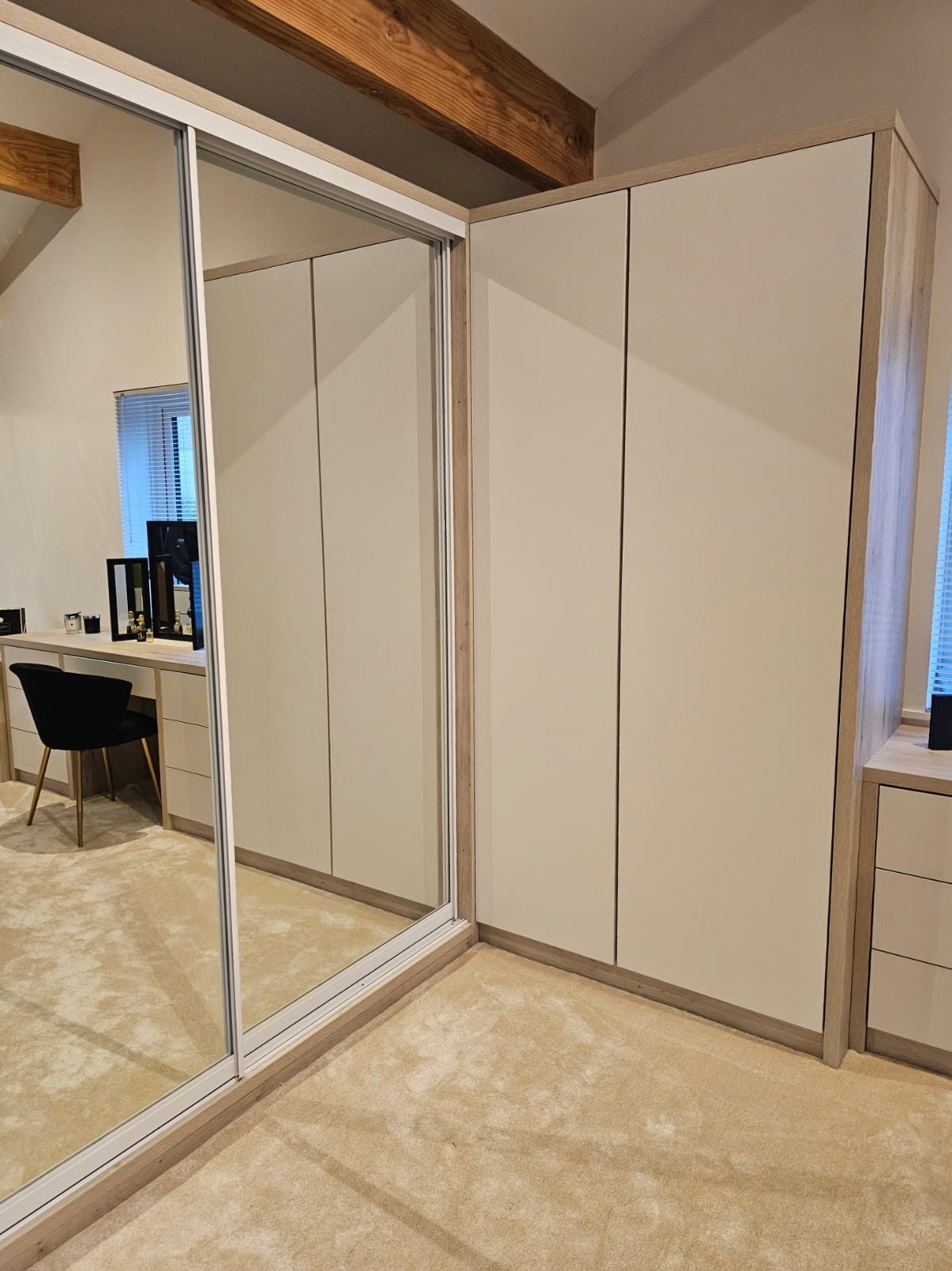 Floor-to-ceiling fitted wardrobes built around a bedroom alcove